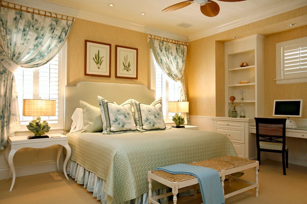 What is a Coverlet for a Tropical Bedroom with a Ceiling Fan and One of a Kind Custom Home at Grey Oaks by Romanza Interior Design