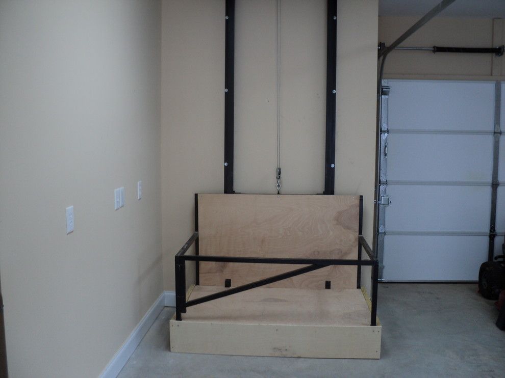 What is a Dumbwaiter for a  Spaces with a Custom Garage and Dumb Waiter by Don Thomas Construction