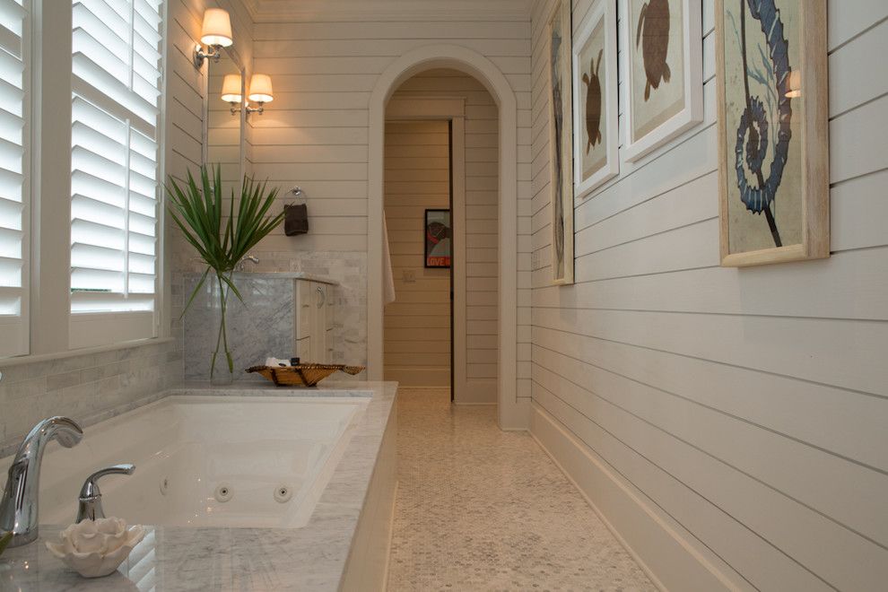 What is Shiplap for a Beach Style Bathroom with a Marble Tub Surround and Rice Watersound Residence 1 by Eric Marcus Studio