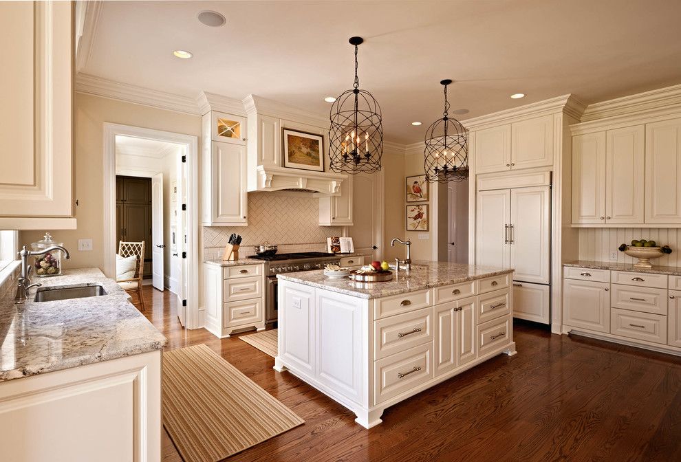 White Galaxy Granite for a Traditional Kitchen with a Stainless Steel Stove and Cc by Carolina Design Associates, Llc