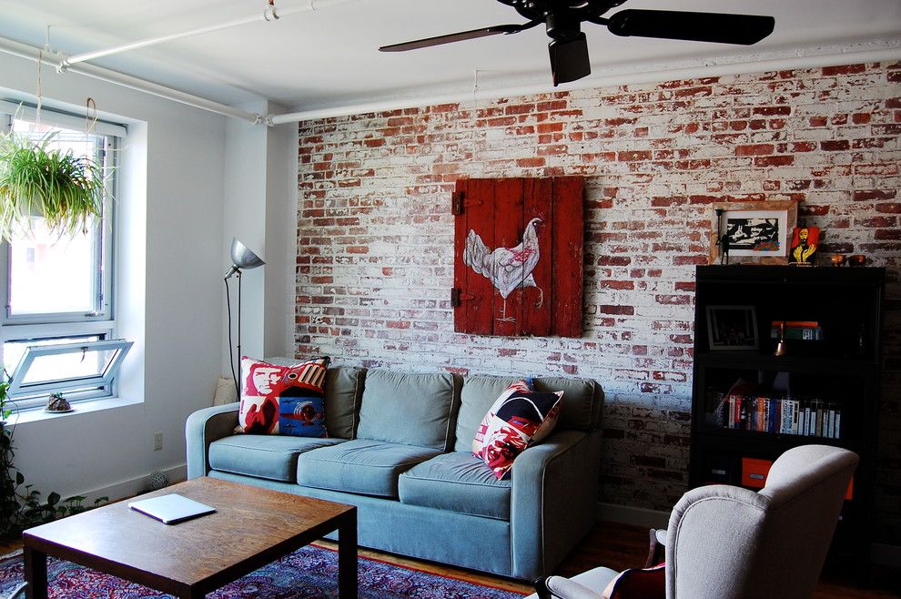 Whitewashing Brick for a Industrial Living Room with a Exposed Electrical Pipes and My Houzz: Textiles Charm an Open Brooklyn Loft by Corynne Pless