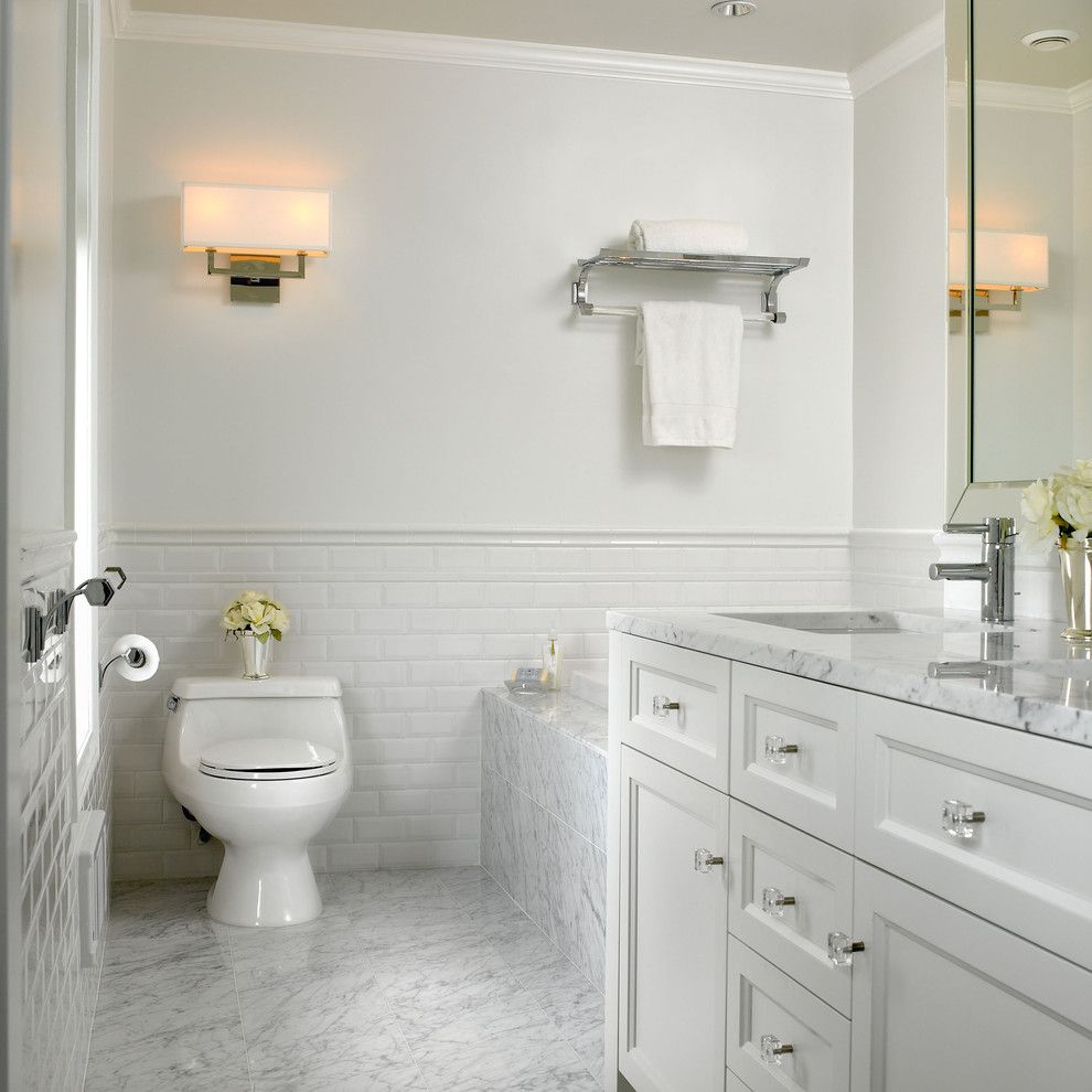 Whitfill Nursery for a Traditional Bathroom with a Soaking Tub and White Marble Bathroom by the Sky is the Limit Design