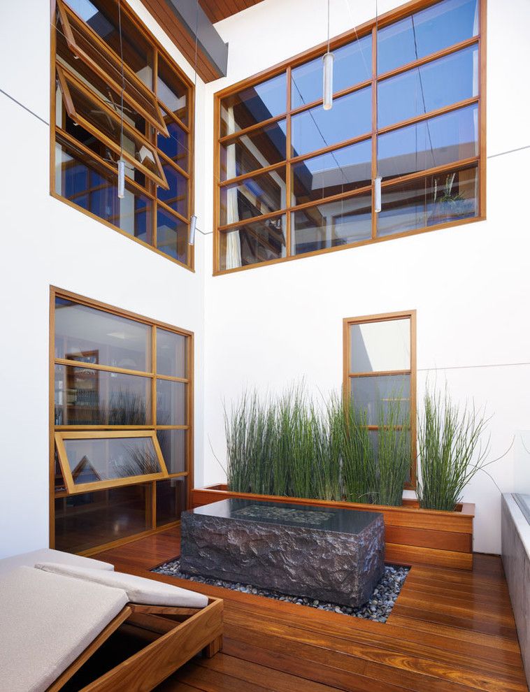 Wilson Parker Homes for a Tropical Patio with a Picture Window and Zen Garden by Rockefeller Partners Architects