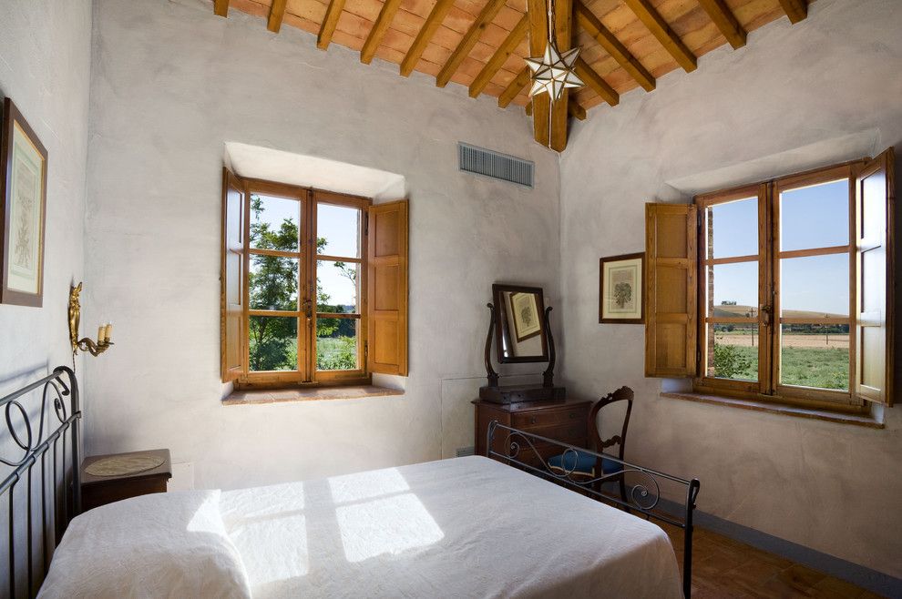 Window Sills for a Mediterranean Bedroom with a Sloped Ceilings and Tuscan Country House, Siena, Italy by Vanni Archive/architectural Photography