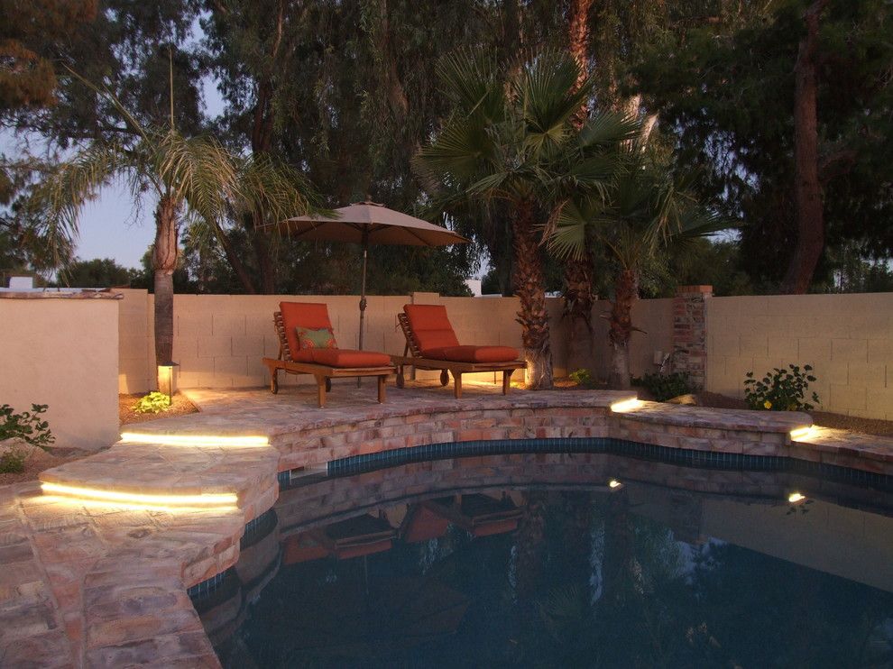 Wolfers Lighting for a Mediterranean Pool with a Outdoor Seating and Raised Deck with Led Ribbon Lighting at Steps. by Clemente Design Studio, Llc