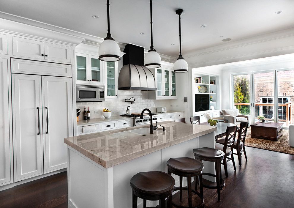 Woodbridge Furniture for a Traditional Kitchen with a Oil Rubbed Bronze Pendant and Kitchen by Tzs Design