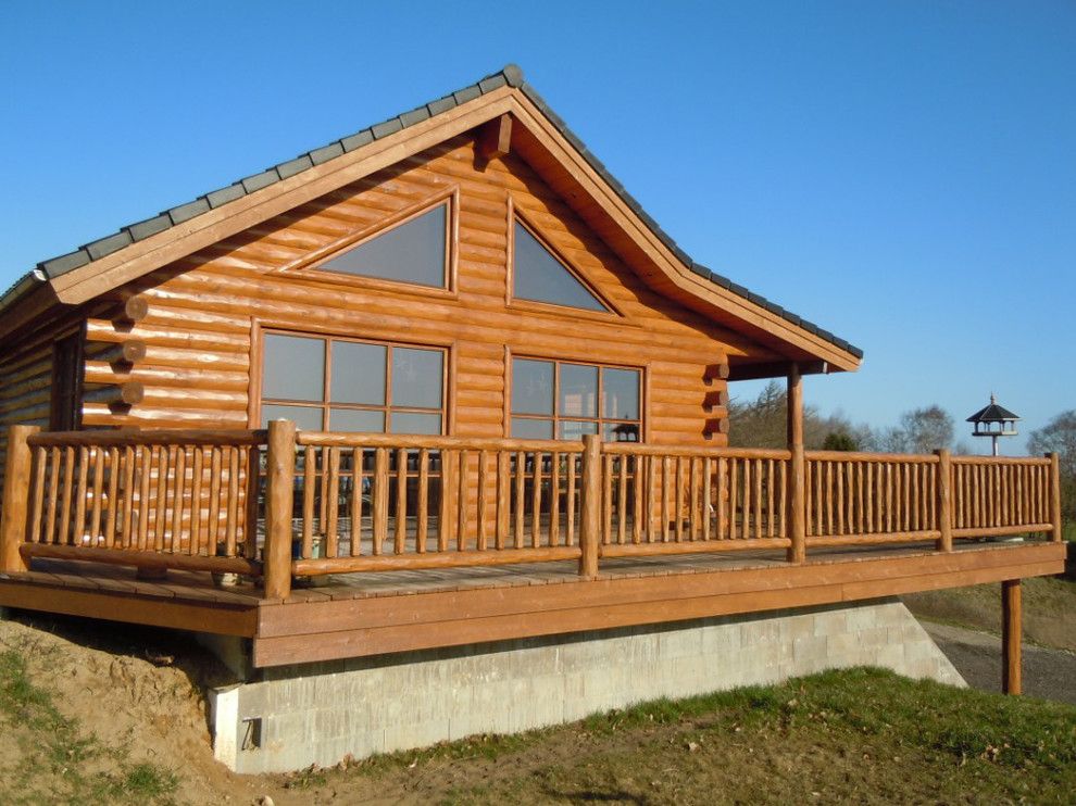 Woodhaven Lumber for a Rustic Exterior with a Knotty Pine Paneling and Cedar Half Log Siding with Butt N Pass Corners by Woodhaven Log & Lumber