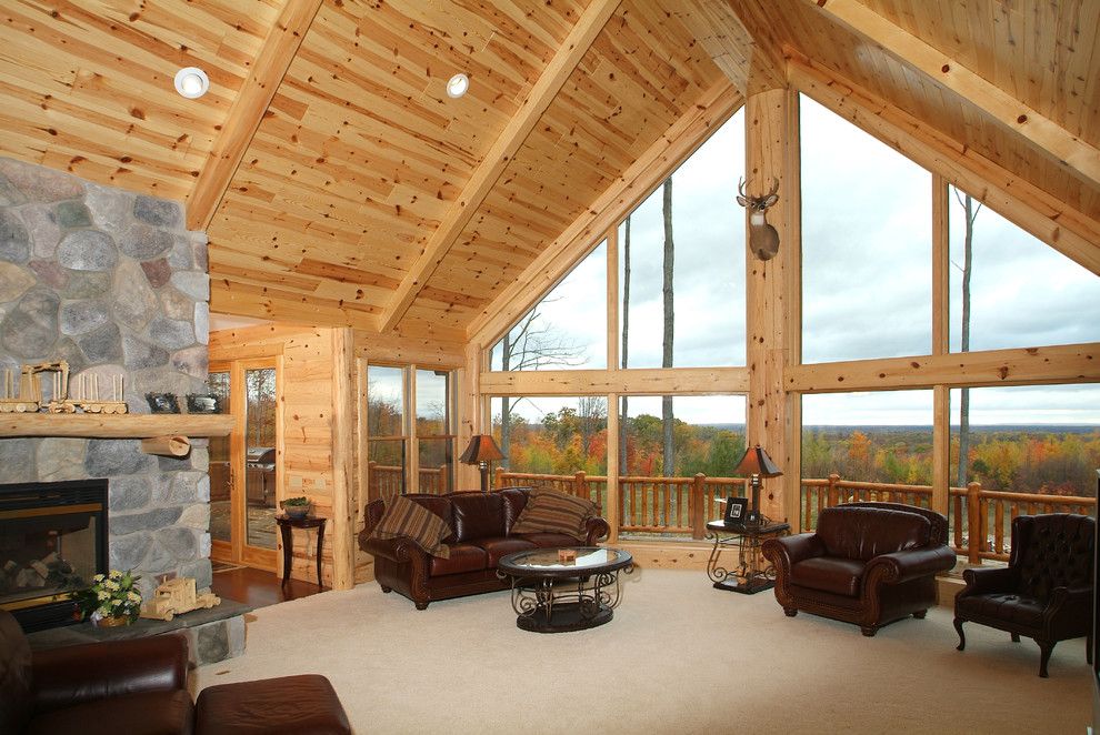 Woodhaven Lumber for a Rustic Living Room with a Log Siding and Knotty Pine Tongue and Groove Paneling Great Room by Woodhaven Log & Lumber