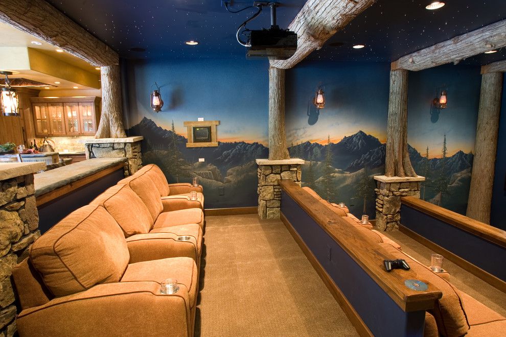 Wormald Homes for a Rustic Home Theater with a Tiered and Glass Forest Summit County by Designworks Development