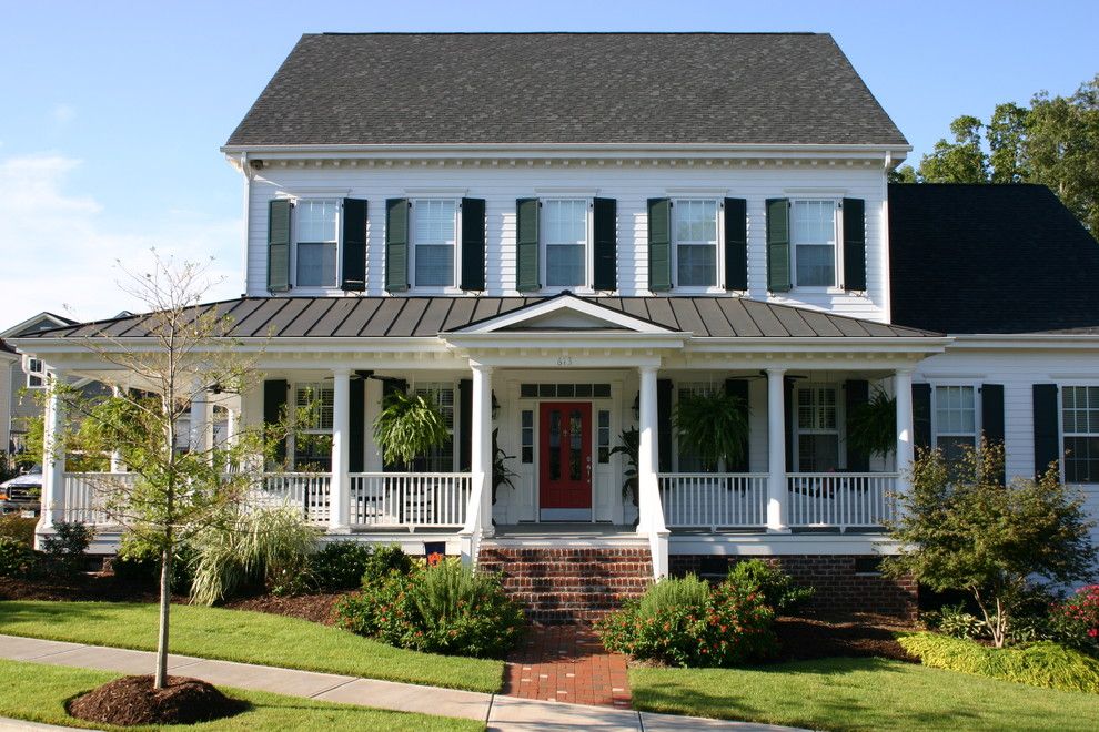 Wrap Around Porch House Plans for a Traditional Exterior with a Lap Siding and the Owens Model at Old Davidson by James Wentling/architect