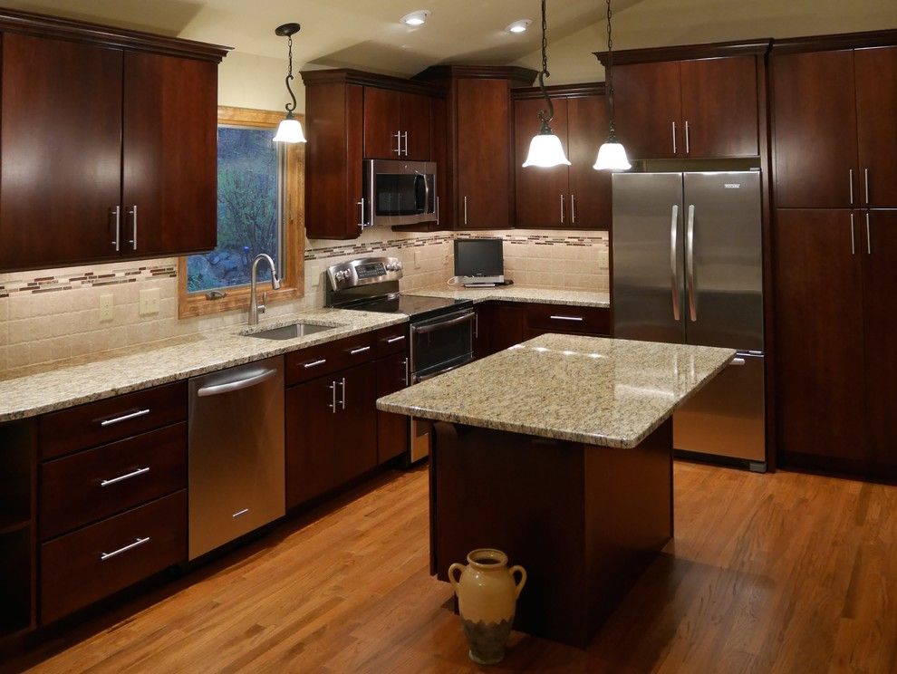 Yorktowne Cabinets for a Modern Kitchen with a Stainless Steel Stove and Asbury Kitchen by Home Solutions