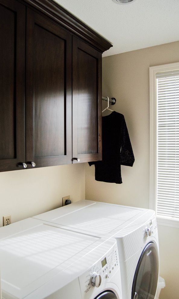 Youngs Furniture for a Transitional Laundry Room with a Baths and Laundry Storage by Delicious Kitchens & Interiors, Llc