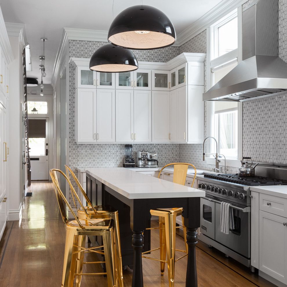 Zaneen Lighting for a Transitional Kitchen with a Gold Counter Stools and Lower Haight Residence by Geddes Ulinskas Architects