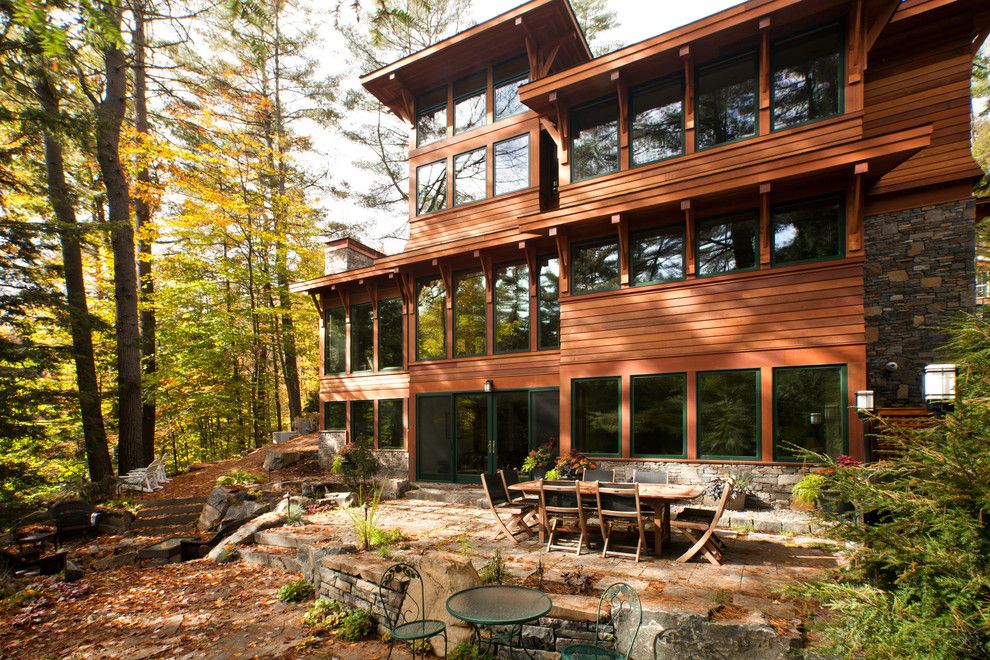 Zimmerman Furniture for a Rustic Exterior with a Flat Roof and Lake Luzerne House by Phinney Design Group