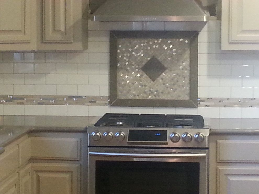 Zodiaq Quartz for a  Spaces with a Zodiaq Quartz Coarse Pepper with a Subway Tile with Quartz F and Zodiaq Quartz with Custom Tile Backsplash by Waters'  Specialty Countertops Inc.