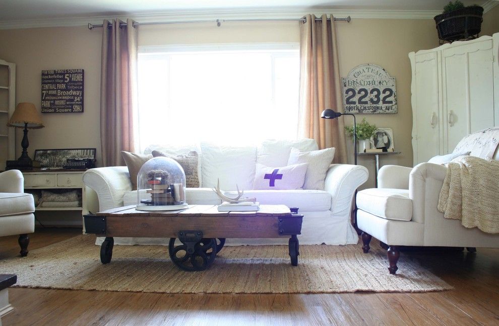 Allure Apartments for a Traditional Living Room with a Industrial Factory Cart Coffee Table and Living Room by Jennifer Grey Interiors