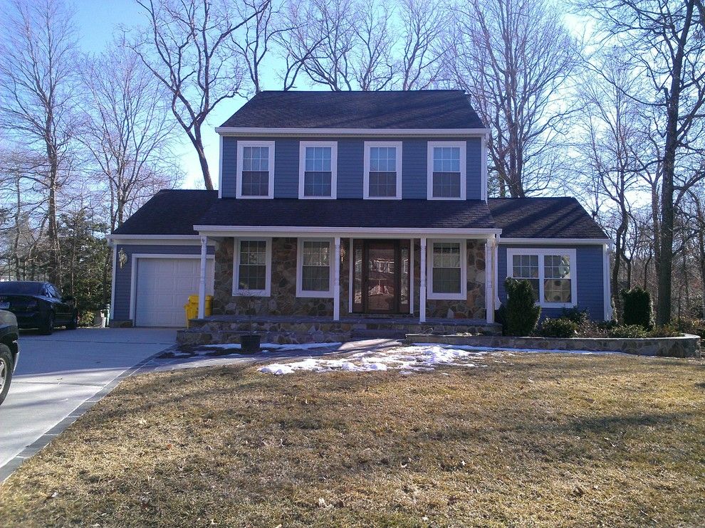 Boral Trim for a Traditional Exterior with a Boothbay Blue and Fiber Cement Siding and Boral Truexterior Trim by Angler Carpentry Llc