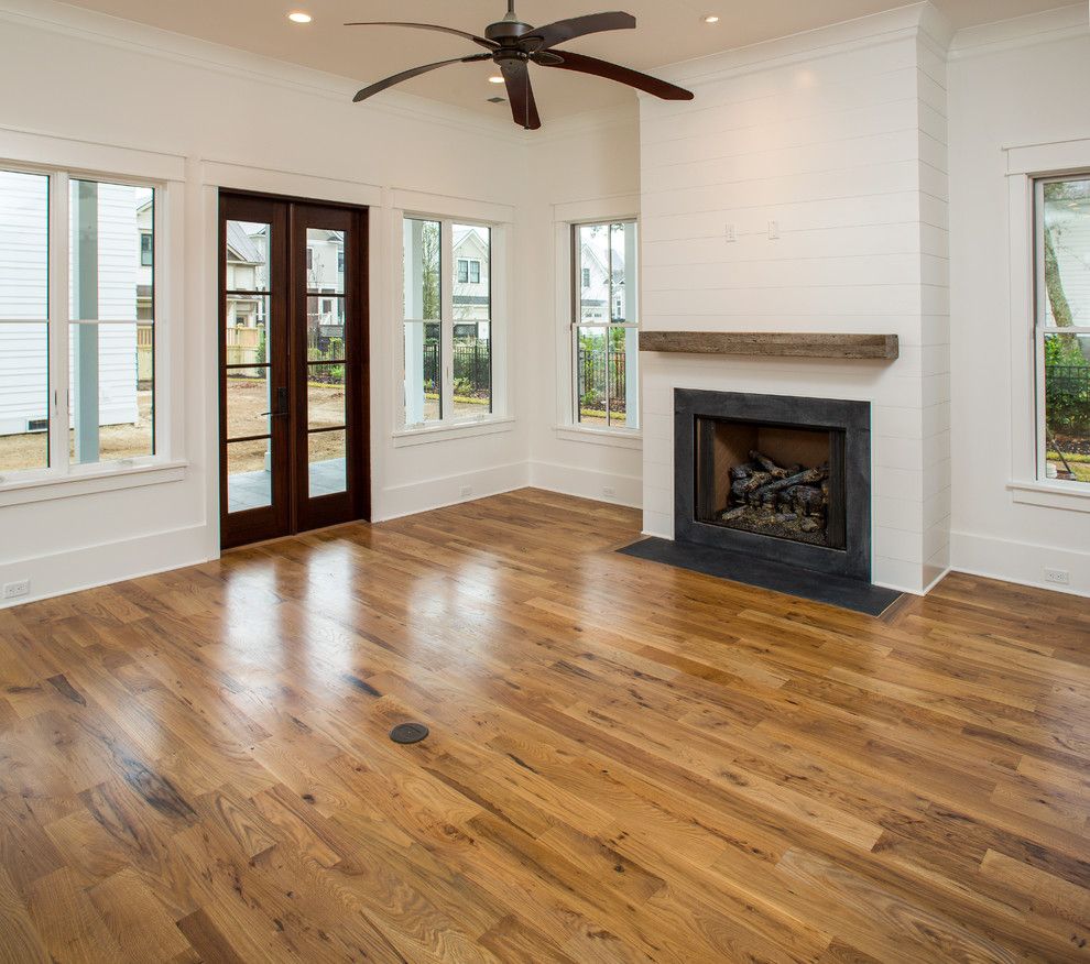 Charleston Forge for a Modern Family Room with a White Kitchen and Simmons Forge 1, Daniel Island, South Carolina by Shelter Custom Built Living