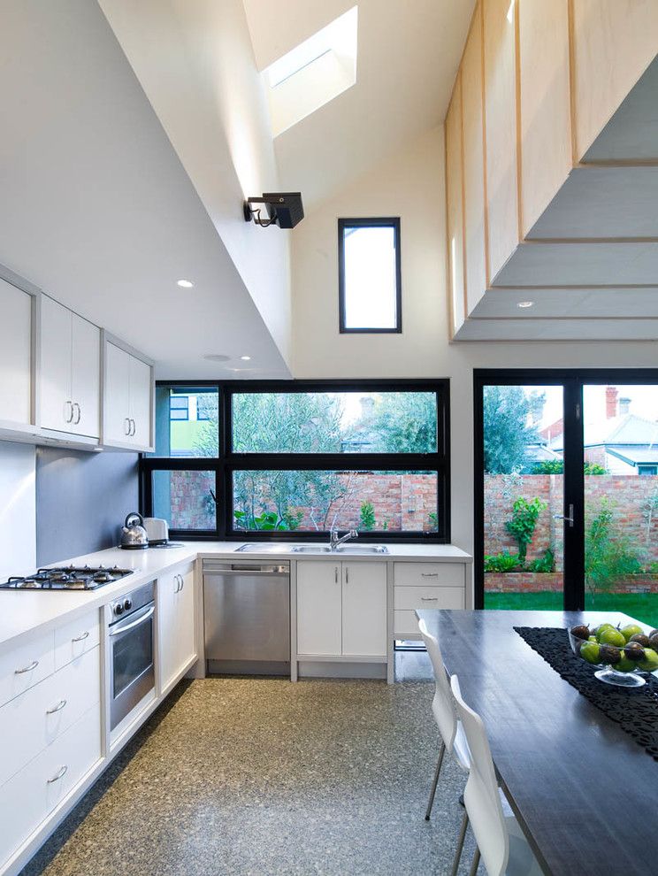 Exposed Aggregate Concrete for a Contemporary Kitchen with a Recessed Lighting and Fitzroy Renovation and Extension by Architecture Matters Pty. Ltd.