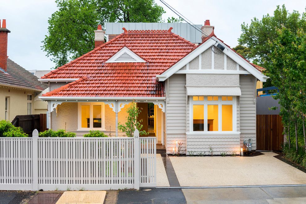 Exposed Aggregate Concrete for a Traditional Exterior with a Extenshion and Carpenter Street by Dig Design