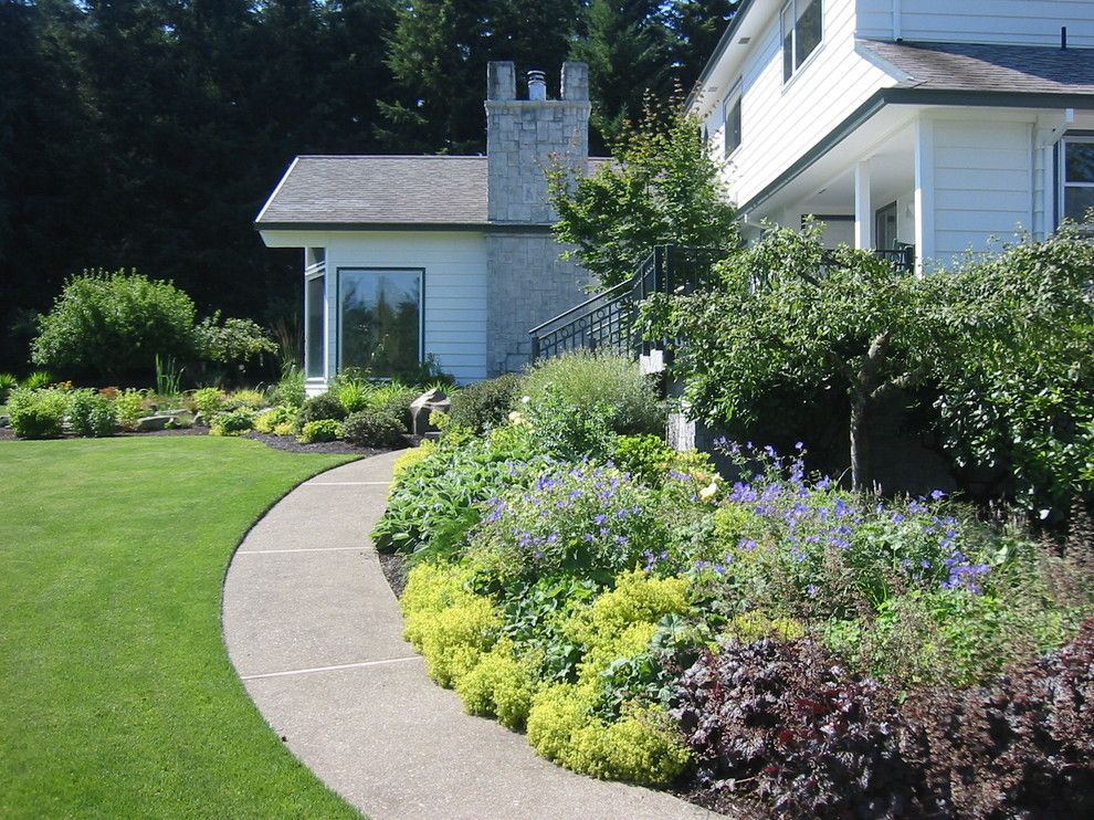 Exposed Aggregate Concrete for a Traditional Landscape with a Perennial Border and Perennial Border with Curved Walk by Landscape East & West