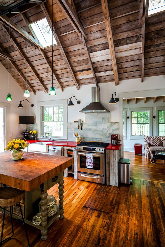 Finehomebuilding for a Industrial Kitchen with a Red Countertop and Kitchen Renovation by Dandeneau Architecture P.l.l.c.