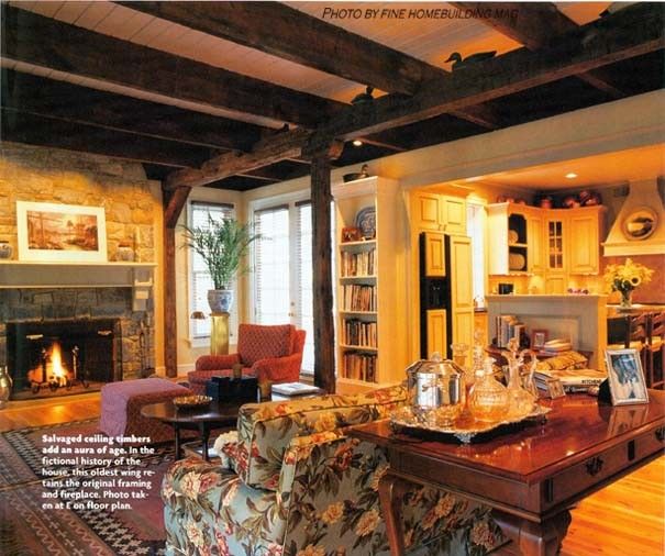 Finehomebuilding for a Traditional Living Room with a Stone Fireplace and Living Space Under Exposed Timber Ceilings Finehomebuildingmag by Kevin Mckenna Architects