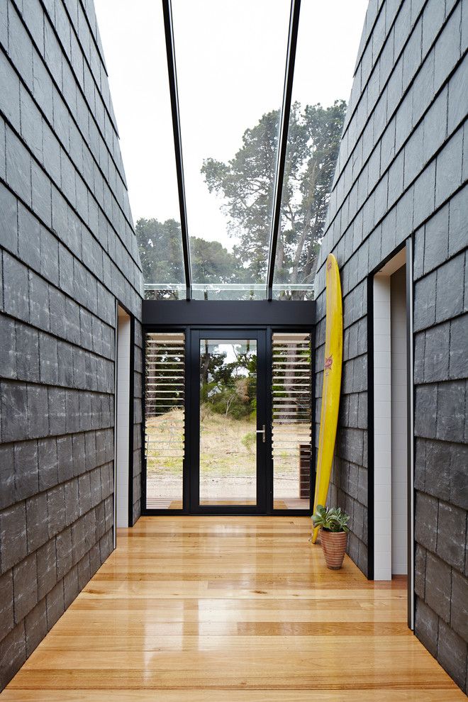 Jalousies for a Contemporary Entry with a Skylight and Wallington Residence by Schored Projects