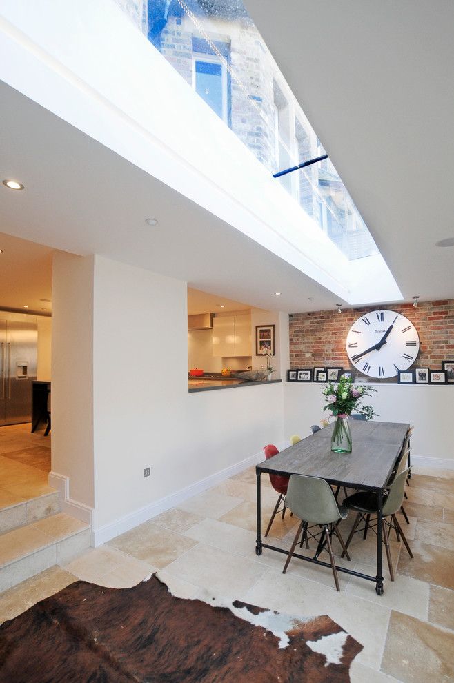 Klinker Brick for a Contemporary Dining Room with a Cowhide Rug and Trinity Hall by Riach Architects