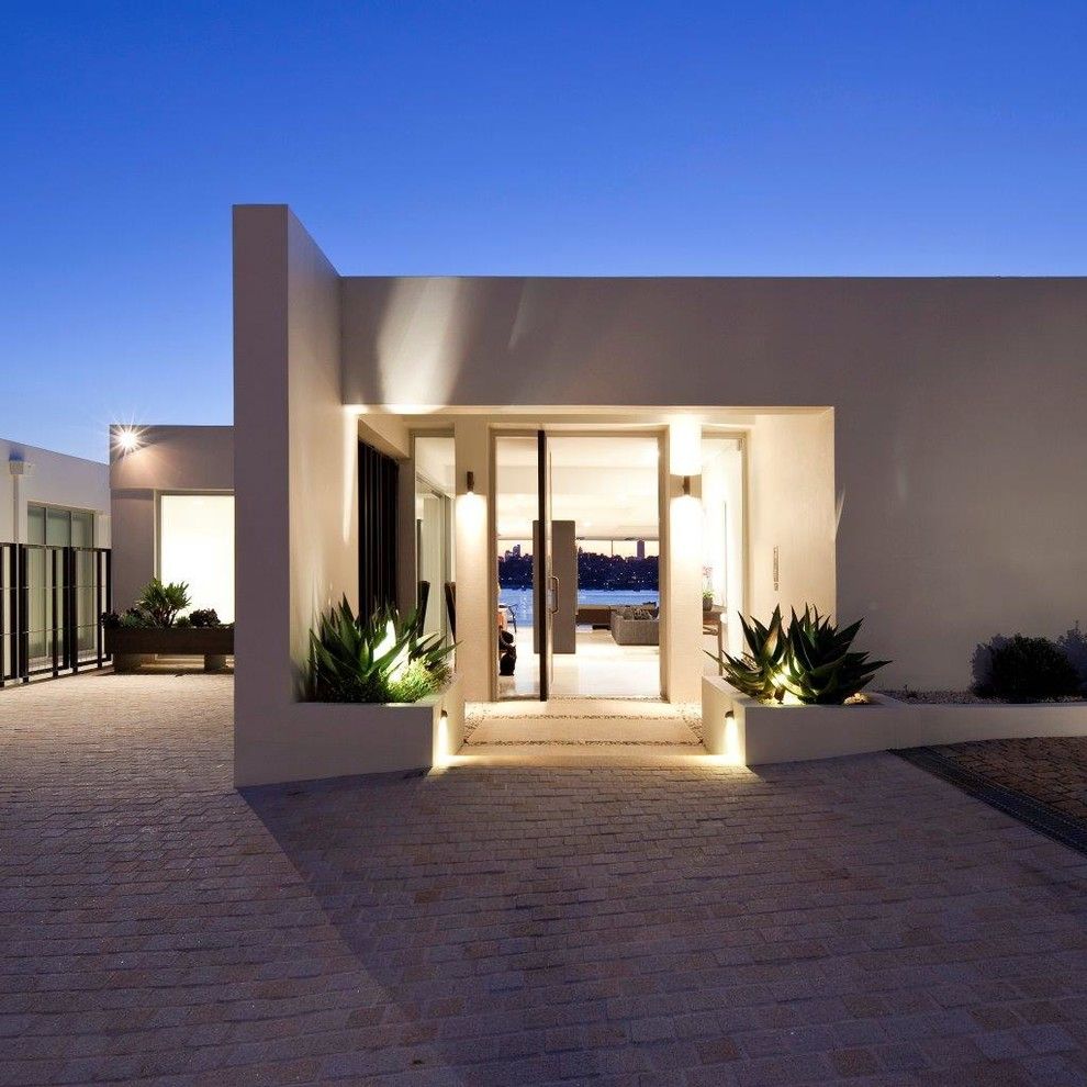 Klinker Brick for a Modern Entry with a Beige Exterior and Rose Bay Residence I by Horizon Habitats