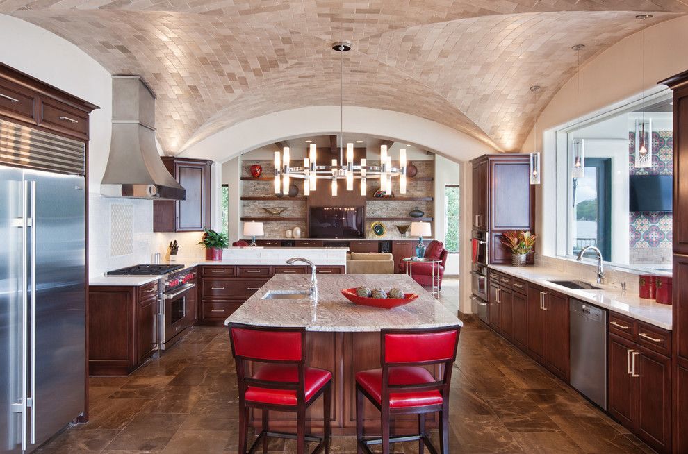 Lakeside Appliance for a Mediterranean Kitchen with a Stainless Steel Hood and Lakeside Spanish Colonial by Austin Design Group