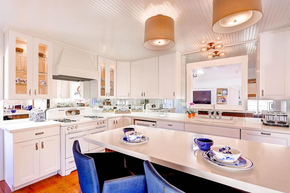 Lakeside Appliance for a Transitional Kitchen with a Mirror Backsplash and Lakeside Remodel by Carnik Residential Design