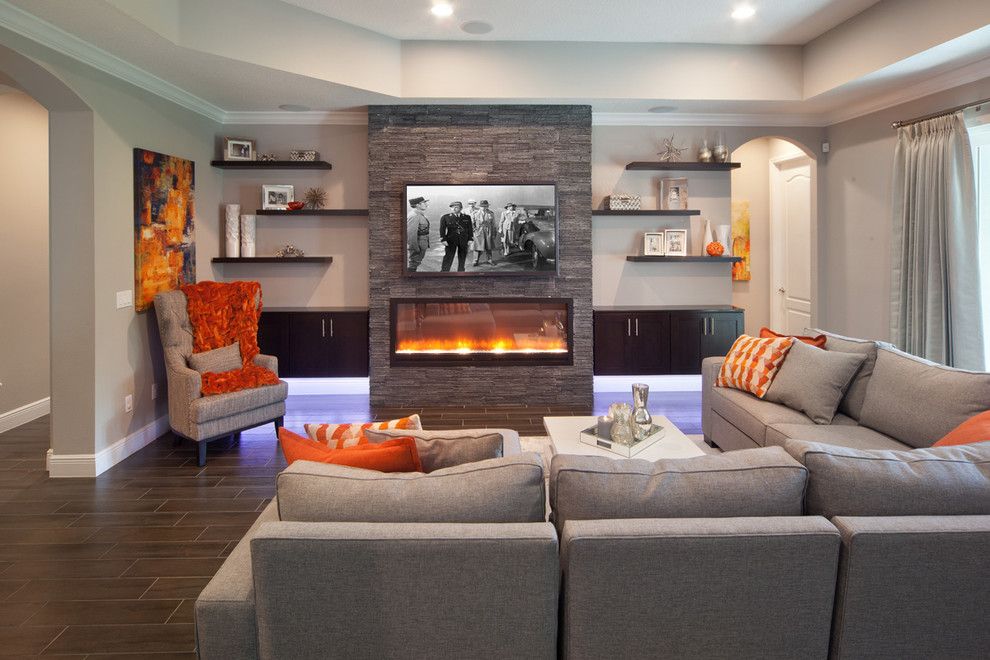 Lazar Furniture for a Transitional Family Room with a Built in Fireplace and Sherbourne Circle by Morrone Interiors