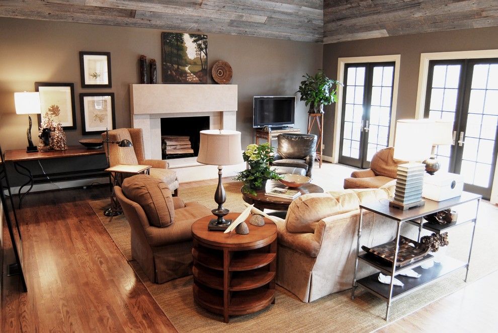 Martin Senour Paints for a Traditional Family Room with a Stone Fireplace and Cozy Family Room W/reclaimed Barn Siding Ceiling by Studio C Architecture & Interiors