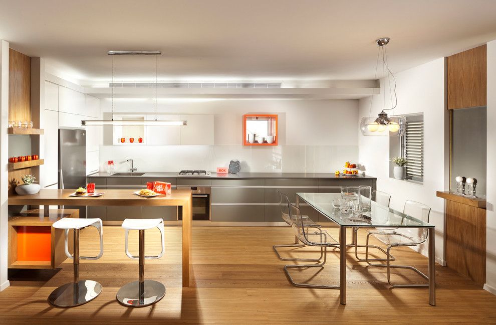 Mobern Lighting for a Modern Kitchen with a Orange and Kitchen by Elad Gonen