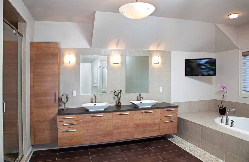 Nessen Lighting for a Contemporary Bathroom with a Light Gray Tile Tub Surround and Modern Master Bathroom   Spa Design by Kuche+Cucina