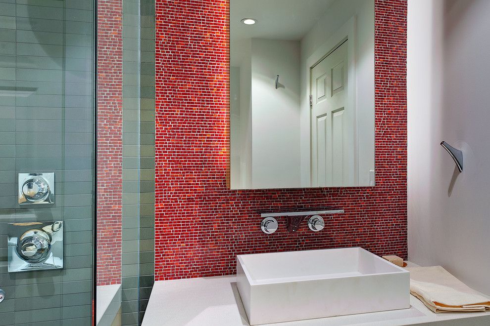 Nessen Lighting for a Modern Bathroom with a Bathroom Mirror and Concealed Lighting at the Backsplash Effect by Michael Tauber Architecture