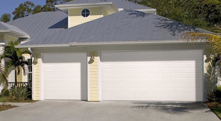 Nicor Lighting for a Beach Style Garage with a Lantern and Raised Panel by Empire Overhead Doors, Llc