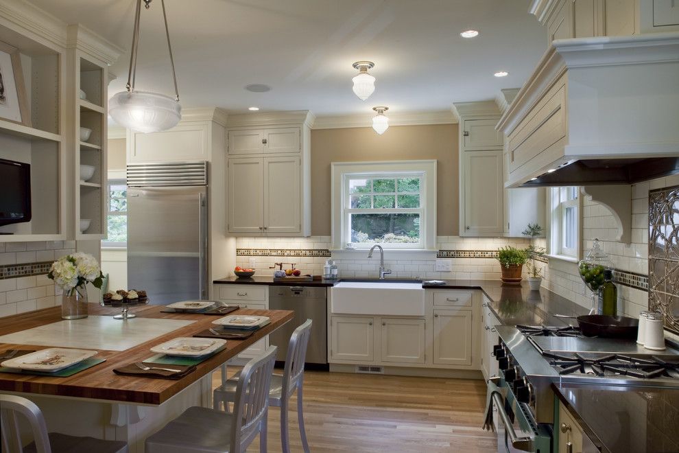 Peaceful Valley Farm Supply for a Traditional Kitchen with a Madrone Countertops with Marble Inset and 1920 Colonial Kitchen by Craftsman Design and Renovation