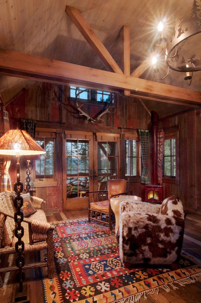 Rawhide Ranch for a Rustic Family Room with a Cowhide Chair and Sitting Area by Ward Young Architecture & Planning   Truckee, Ca