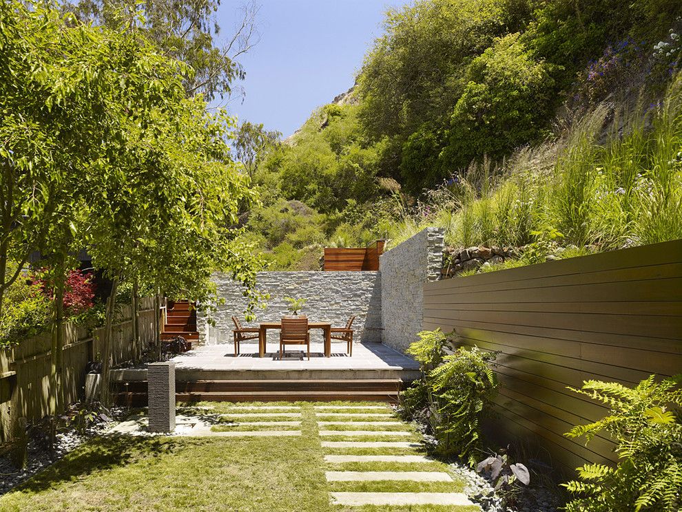 Restaining Wood for a Modern Landscape with a Stone Wall and Cole Valley Hillside   John Maniscalco Architecture by John Maniscalco Architecture