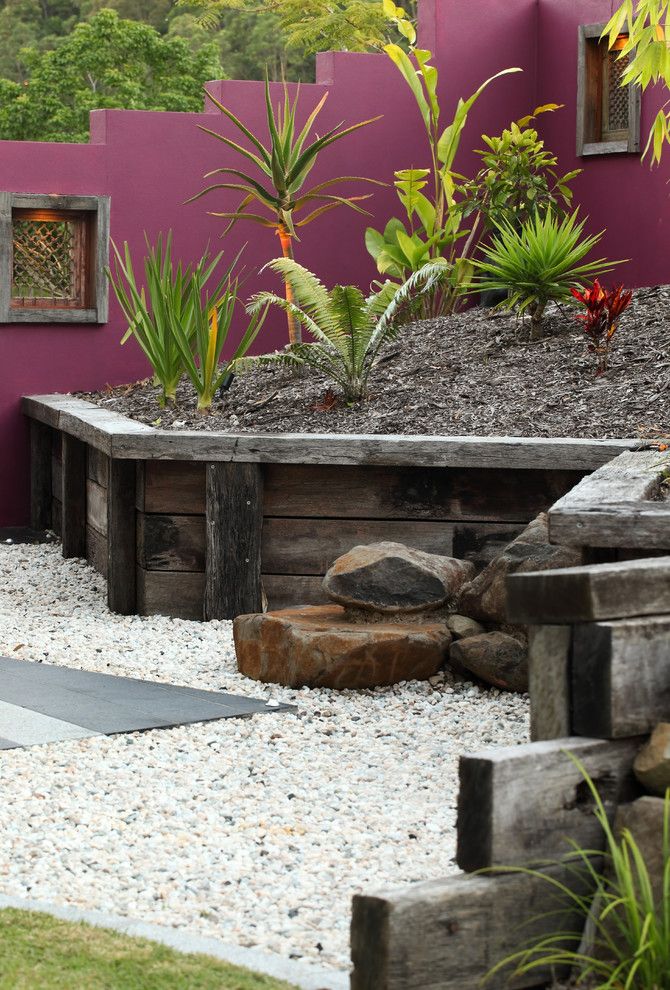 Restaining Wood for a Tropical Landscape with a Gravel and Buderim Meadows by Living Style Landscapes