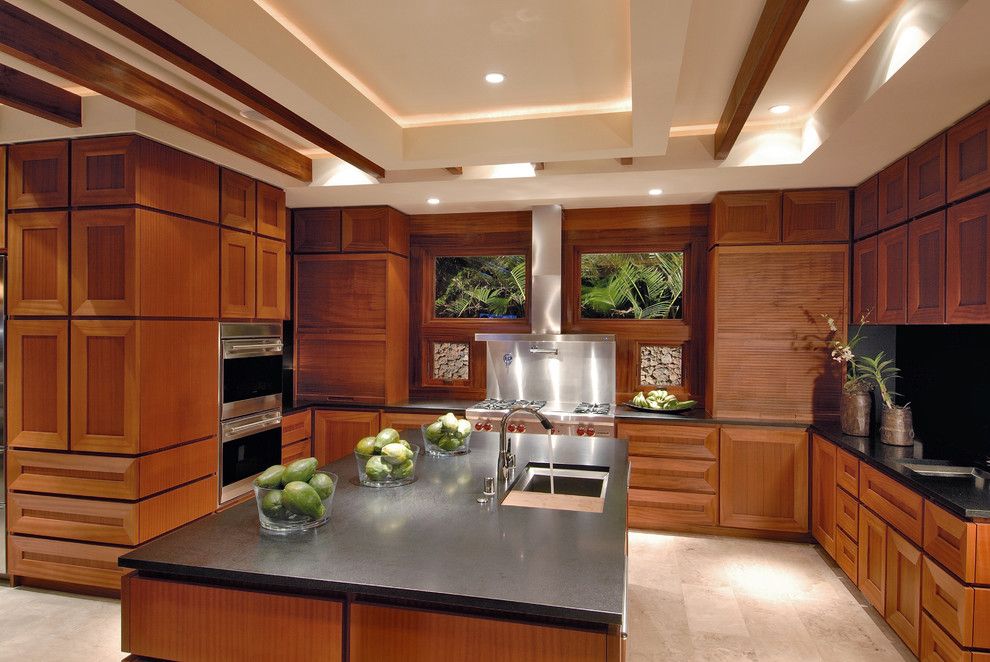 Sapele Wood for a Contemporary Kitchen with a Tray Ceiling and Ownby Design by Ownby Design