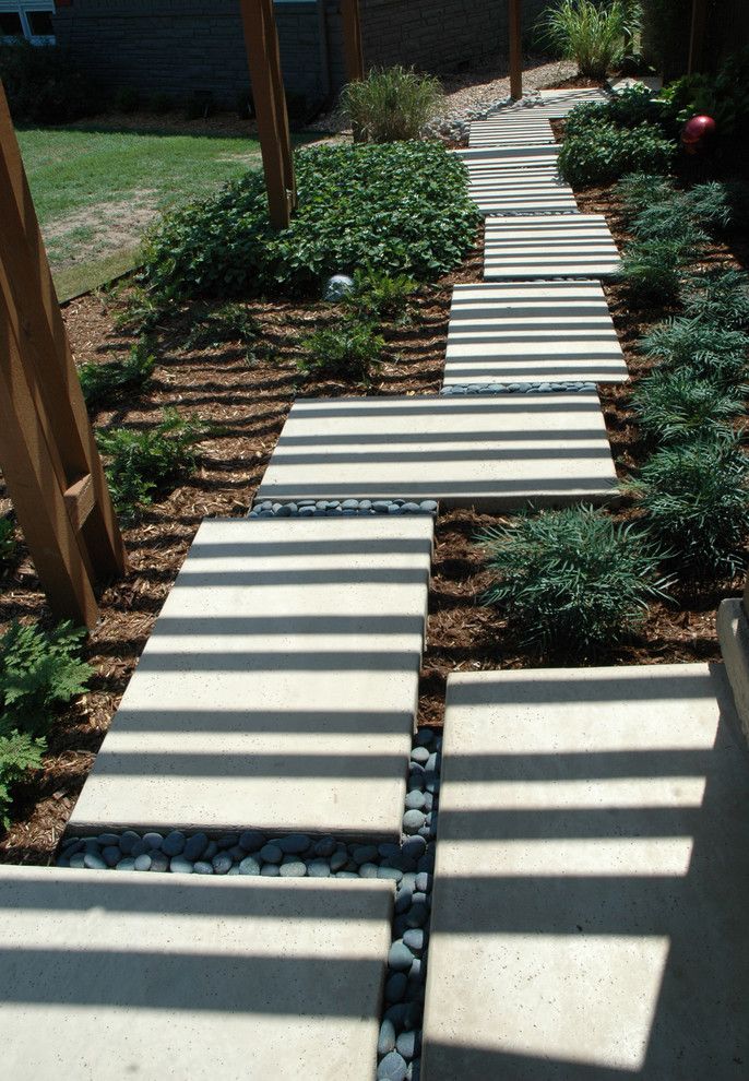 Soft Caress Mahonia for a Contemporary Landscape with a Concrete Sea Salt Finish and California Contempory in the Heart of the Midwest by Kingdom Landscape