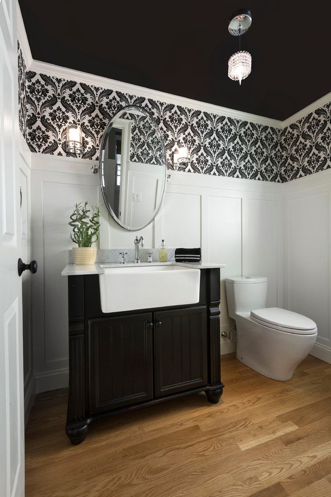 Southeastern Furniture for a Traditional Powder Room with a Oval Mirror and Hampshire Project by Haddad Hakansson Design Studio