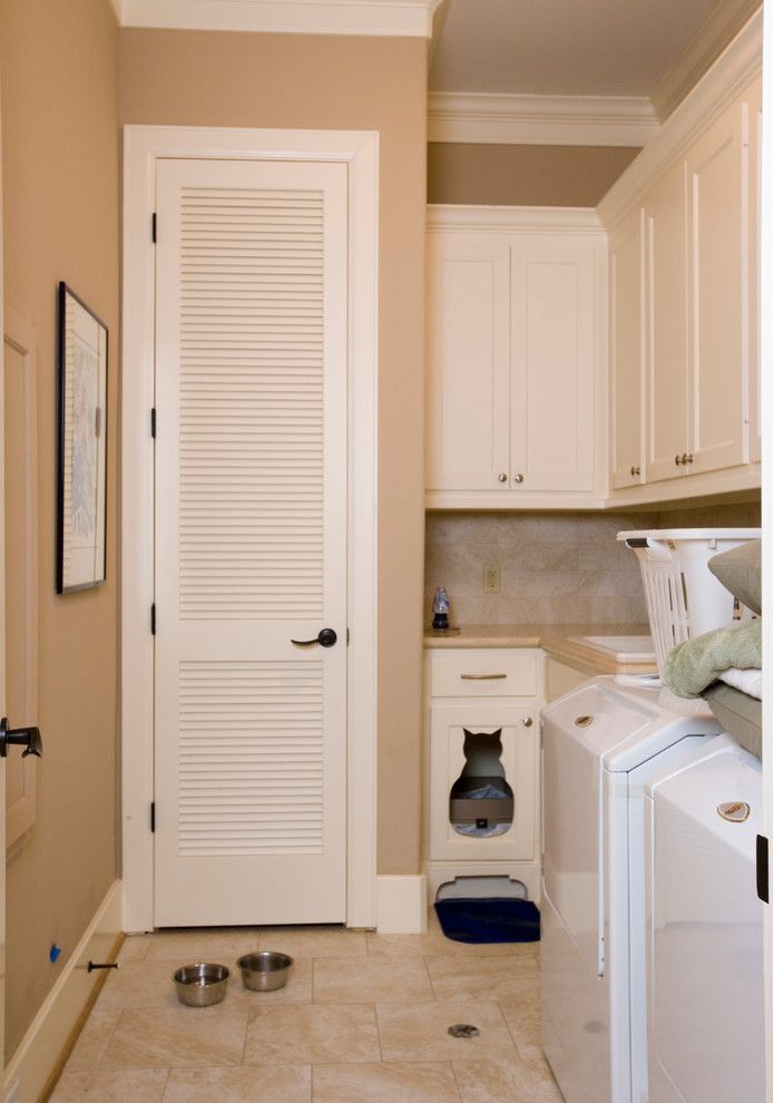 Tankless vs Tank Water Heater for a Traditional Laundry Room with a Washer and Allegro Builders + West 32nd by Allegro Builders