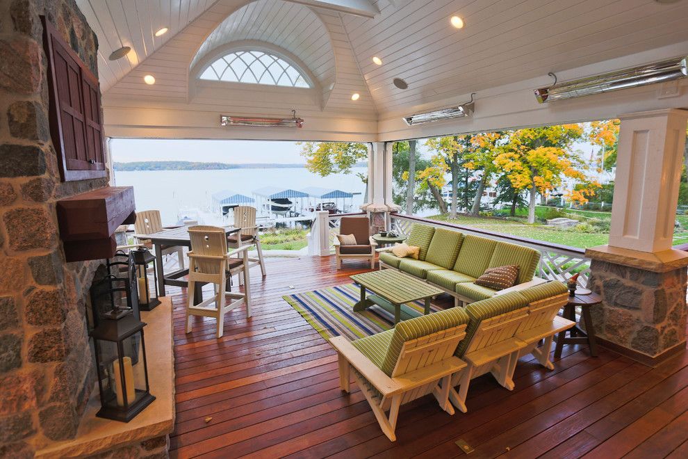 Tankless vs Tank Water Heater for a Traditional Porch with a Fireplace Mantel and Lake Geneva Screen Porch by Lake Geneva Architects