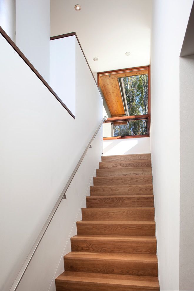 2700k Light for a Contemporary Staircase with a Stainless Steel Handrail and Stairs by Ohashi Design Studio