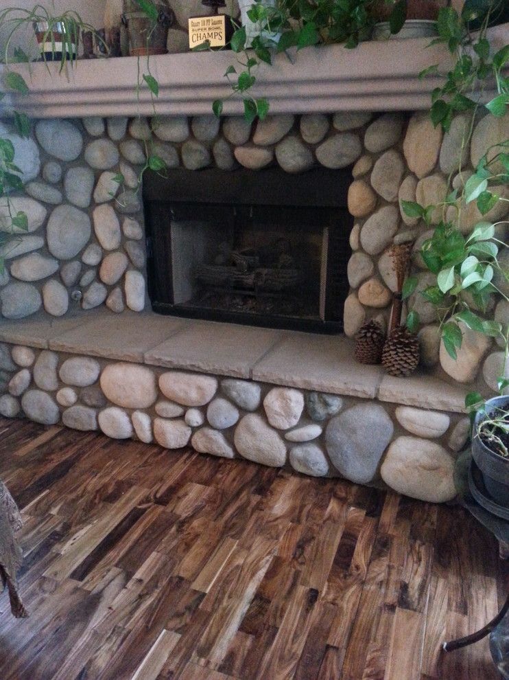 Abbey Flooring for a Rustic Living Room with a Large Fireplace and Hardwood by Prescott’S Abbey Flooring and Design