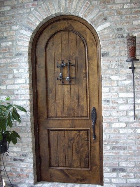 Acme New Orleans for a Traditional Wine Cellar with a Custom Wine Cellar Door and Knotty Alder Custom Wine Cellar Door La in an Early American Stain by Wine Cellar Specialists